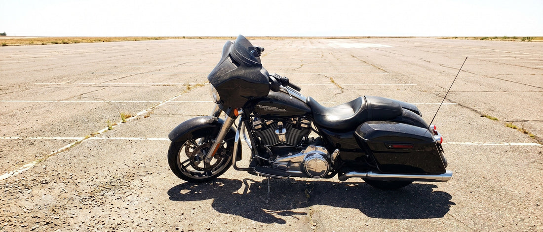 Harley Street Glide parked in full sun in a hot parking lot needing motorcycle seat shade