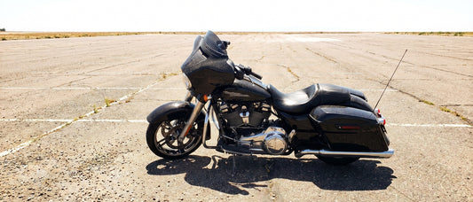 Harley Street Glide parked in full sun in a hot parking lot needing motorcycle seat shade