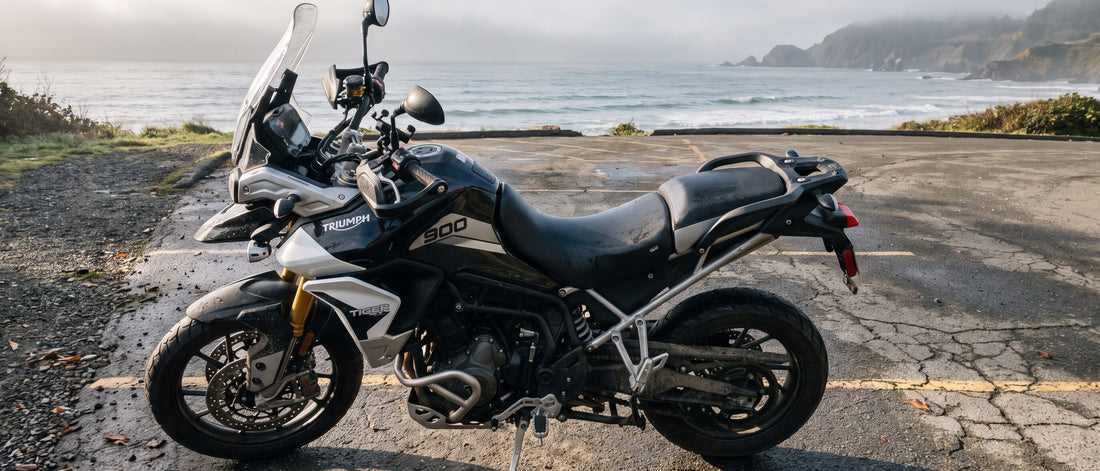 Triumph motorcycle seat covers guide: Triumph Tiger 900 parked on a coastal pull-off at early morning